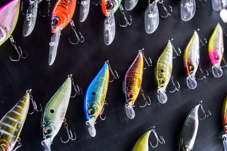 Moscow, Russia-February 20, 2020: 47 international exhibition hunting and FISHING in RUSSIA. fishing wobblers and baubles of different colors and sizes in the exhibition window.のeditorial素材