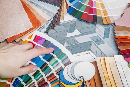 select a color from the color sample pallets in the designers workspace. choice of materials, textures and colors for room renovationの写真素材