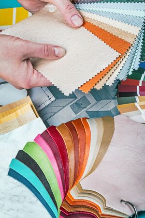 select a color from the color sample pallets in the designers workspace. choice of materials, textures and colors for room renovationの写真素材