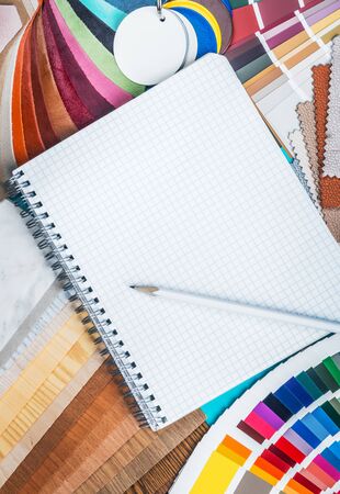 choice of materials, textures and colors for room renovation. White Notepad with space to write your textの写真素材