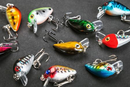 small fishing lures for catching predatory fish on a black backgroundの写真素材