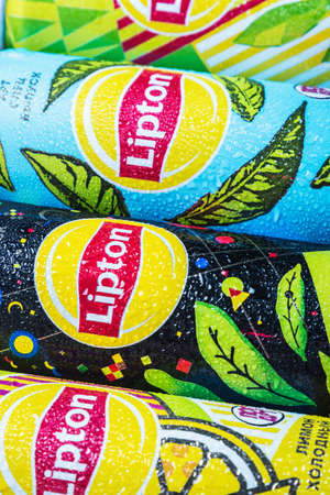 Moscow, Russia-June 16, 2020: different types of cold Lipton tea in a different design aluminum can. Lipton the tea trademark registered by Thomas Lipton is owned by Unileverのeditorial素材