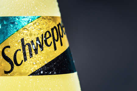Moscow, Russia-June 16, 2020: Schweppes carbonated drink in a plastic bottle on a black background. Schweppes is a brand of soft drinks founded by Jacob Schwepp in 1783のeditorial素材