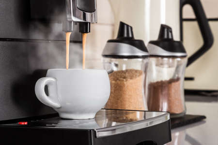 ceramic Cup of coffee Prepared on the coffee machineの写真素材