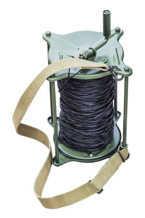 military coil with telephone cable isolated on white background. For use and telephone connection in the army on the battlefield, in the Ministry of emergency situations, construction sites, etc.の写真素材