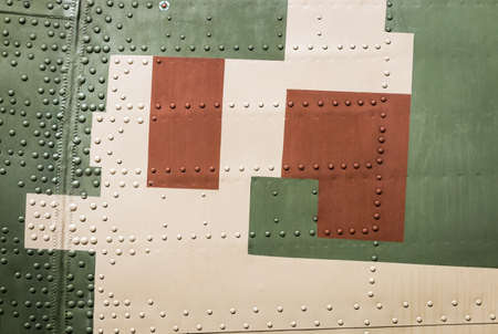 ARMOR PLATING of an airplane or helicopter. Large rivets on metalの写真素材