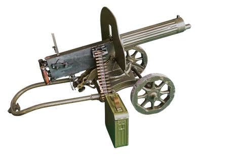 Maxim machine gun with a box of cartridges and a tape inserted into the machine gun. Isolated on a white backgroundの写真素材