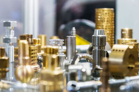 different shapes and sizes of parts turned on a lathe or milling machine. The details of processing of metalの写真素材