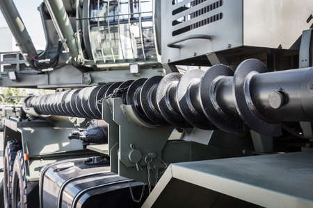 long drill for construction work fixed on the side of the construction machinery machine