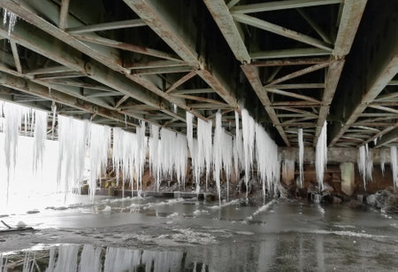 lots of hanging icicles under the bridgeの写真素材