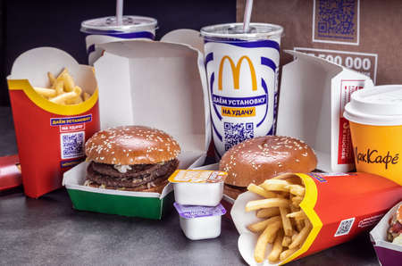 various burgers with French fries, cola and sauces from McDonalds restaurantのeditorial素材