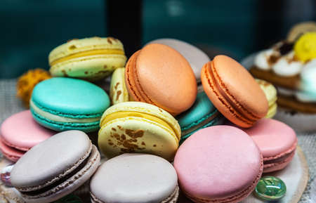macaroon cakes with different fillings on the counter of a pastry shopの写真素材