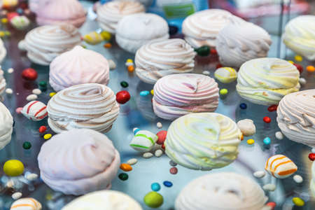 marshmallows with different flavors on the counter of a pastry shopの写真素材