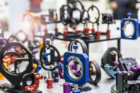 optics and laser holders and motorized positioners on the optical tableの写真素材