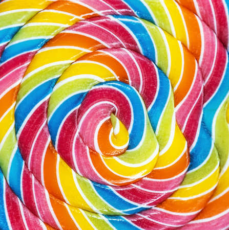 colorful spiral of a Lollipop on a stick backgroundの写真素材