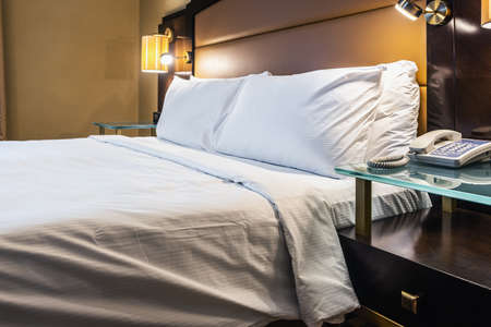 king size bed in the hotel room made for meeting guestsの写真素材