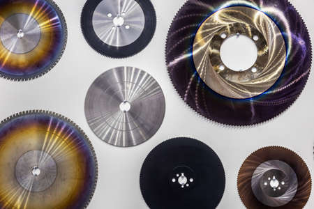 sawmill cutting discs hang as a pattern on the wallの写真素材