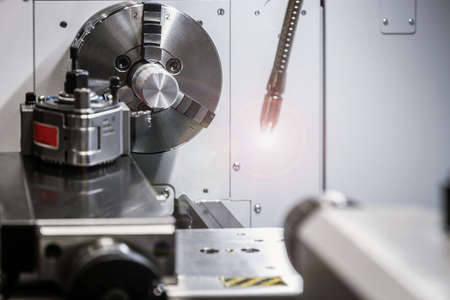 CNC lathe machine or Turning machine drilling the steel rodの写真素材