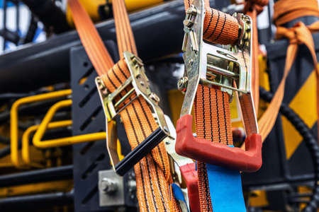 tension safety belts with mechanical locks. stretch textile slings holdの写真素材