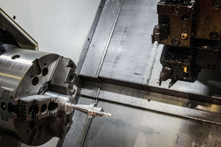 CNC lathe machine or Turning machine drilling the steel rodの写真素材