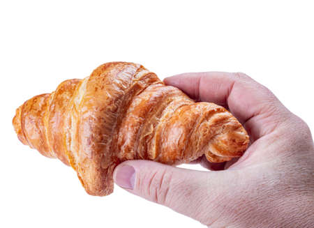 croissant in hand isolated on white backgroundの写真素材