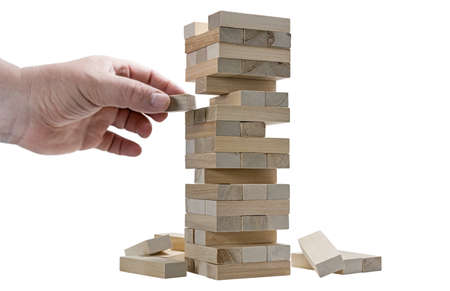 hand game is a tower made of wooden blocks isolatedの写真素材