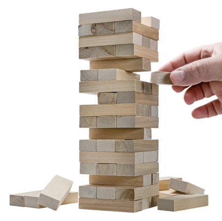 hand game is a tower made of wooden blocks isolatedの写真素材