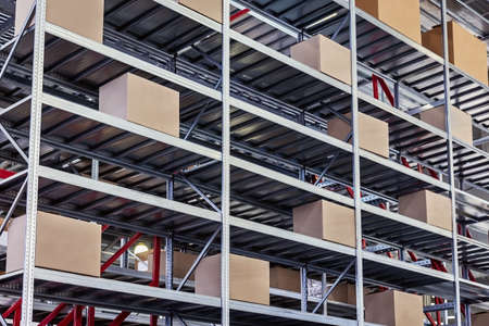 Retail Warehouse full of Shelves with Goods in Cardboard Boxesの写真素材