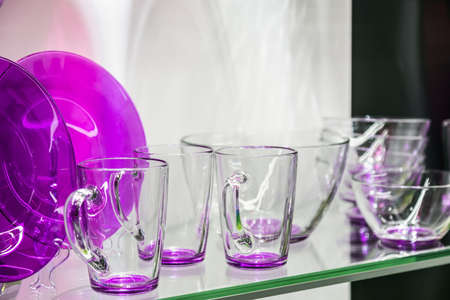 different-colored glass cups, plates and saucersの写真素材