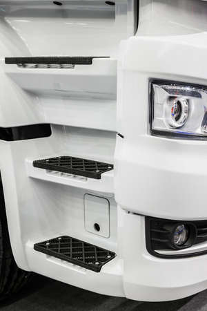 Step of truck into the cab of a white car,の写真素材