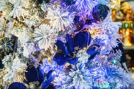 decorations of flowers and garlands on the Christmas treeの写真素材