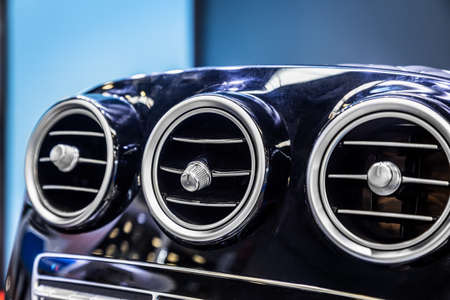 air ducts are round on the central panel of the sports carの写真素材