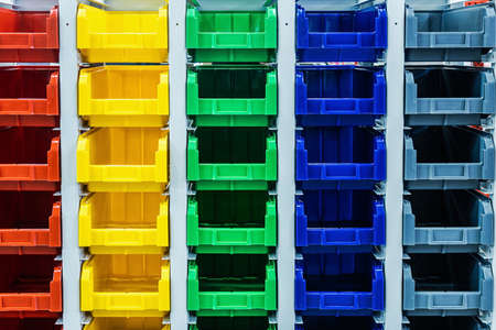plastic boxes of different colors used in warehousesの写真素材