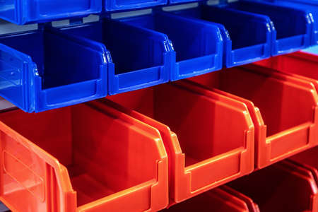 plastic boxes of different colors used in warehousesの写真素材