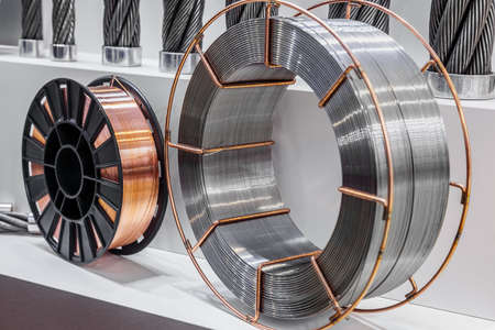 coils with copper and steel wire on a lightの写真素材