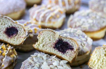 donuts with different flavors, fillings and different sprinklesの写真素材