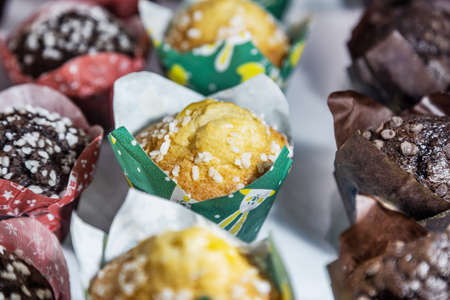 muffins with different flavors, fillings and different sprinklesの写真素材