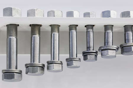 different size bolts with nuts are screwed as a sampleの写真素材