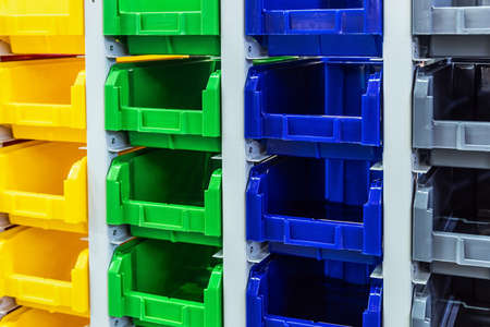 plastic boxes of different colors used in warehousesの写真素材