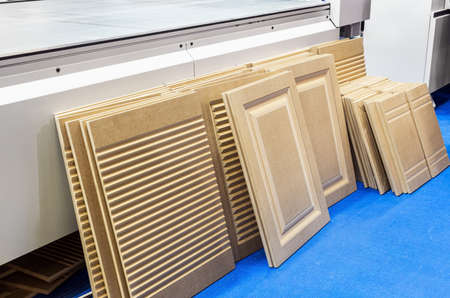 production of kitchen facades on a drilling and filler machineの写真素材