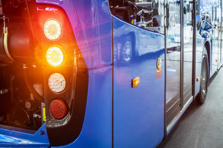taillights of a city bus at a public transport stopの写真素材