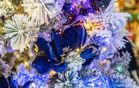 beautiful decorations of flowers and garlands on the Christmas treeの写真素材
