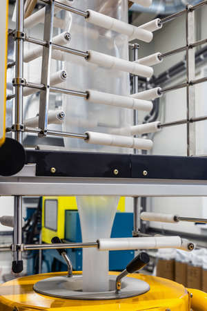 industrial machine blows out cellophane film and paintsの写真素材