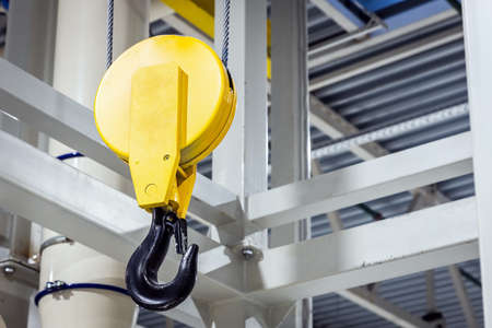 Crane hook inside factory building, industrial backgroundの写真素材