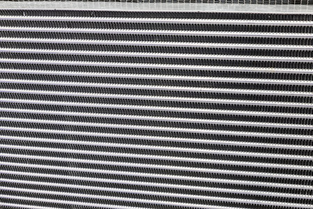 background of the radiator grille of a car or construction equipmentの写真素材