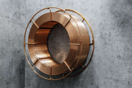 coil with copper wire on a gray backgroundの写真素材