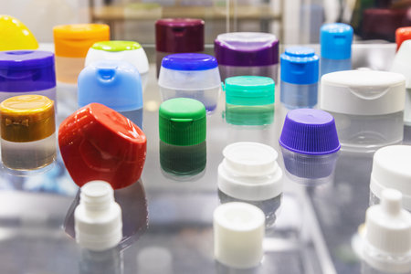 plastic lids of different shapes and purposes in different colorsの写真素材