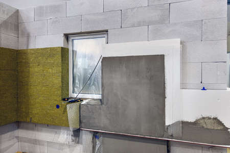 construction of a house and insulation of the wall of the house with layersの写真素材