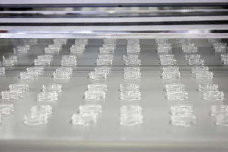 parts of the conveyor with plastic products in productionの写真素材