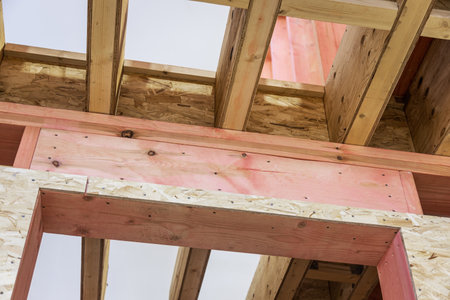 Installing attic insulation material and roof support truss system